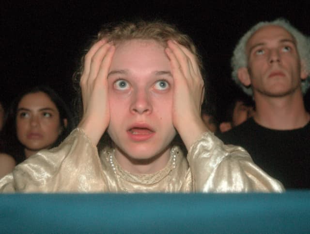 You are a psychic doing cold readings. You just had a real vision about someone in the audience, and it is horrifying.